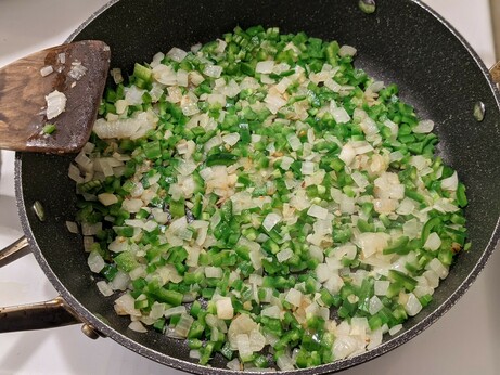Frying pan with the onions and garlic starting to brown and the jalapeños only just picking up a bit of heat.