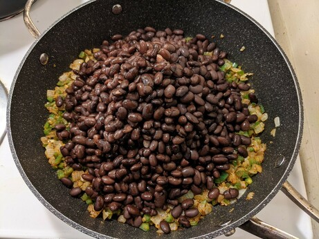 Big old mound of beans heaped atop the foundation of cooked vegetables!