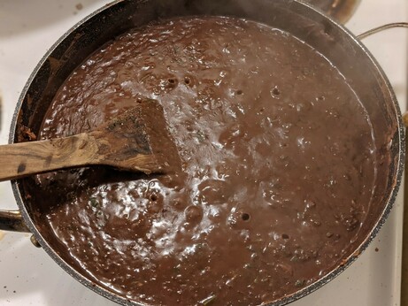 Cilantro now mixed in, the beans are cooking down and looking rich and aromatic and promising.