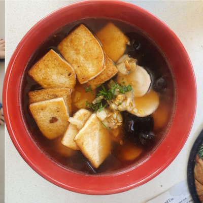 Shoyu Ramen with fish balls, and fried tofu topping